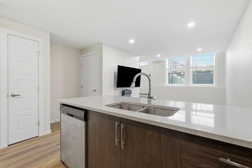 124 Cranbrook Square Se, Calgary, AB - Indoor Photo Showing Kitchen With Double Sink