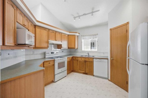 369 Hidden Valley Place Nw, Calgary, AB - Indoor Photo Showing Kitchen With Double Sink