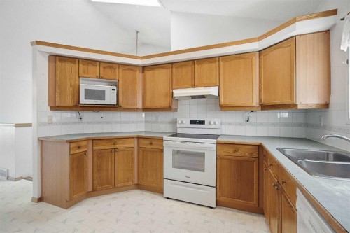 369 Hidden Valley Place Nw, Calgary, AB - Indoor Photo Showing Kitchen With Double Sink