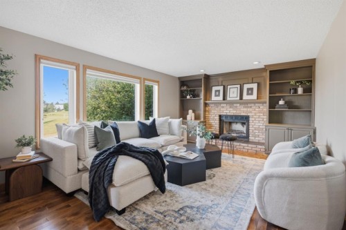 473 Hawkford Way Nw, Calgary, AB - Indoor Photo Showing Living Room With Fireplace
