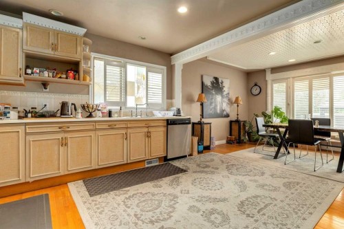 783 Lake Twintree Crescent Se, Calgary, AB - Indoor Photo Showing Kitchen With Double Sink