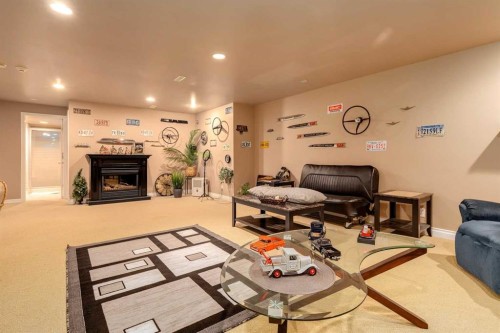 783 Lake Twintree Crescent Se, Calgary, AB - Indoor Photo Showing Living Room With Fireplace