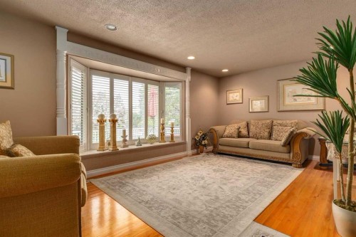 783 Lake Twintree Crescent Se, Calgary, AB - Indoor Photo Showing Living Room
