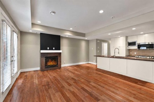 10-1717 27 Avenue Sw, Calgary, AB - Indoor With Fireplace