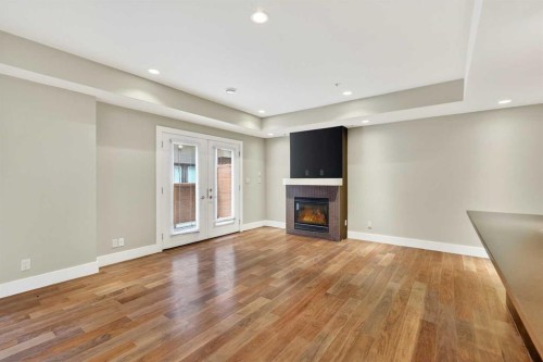 10-1717 27 Avenue Sw, Calgary, AB - Indoor With Fireplace