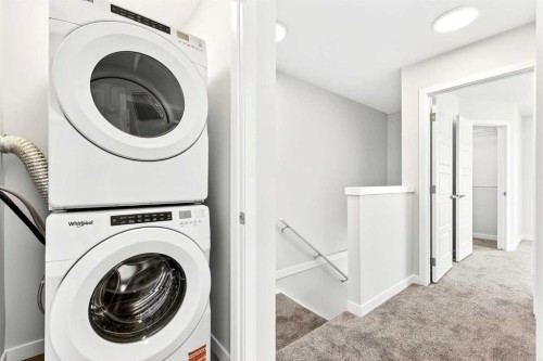 302-40 Creekside Way Sw, Calgary, AB - Indoor Photo Showing Laundry Room