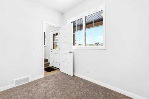 302-40 Creekside Way Sw, Calgary, AB - Indoor Photo Showing Other Room