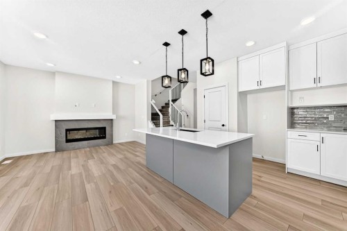135 Mallard Heath Se, Calgary, AB - Indoor With Fireplace