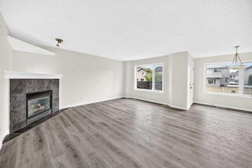 531 Stonegate Road Nw, Airdrie, AB - Indoor Photo Showing Living Room With Fireplace