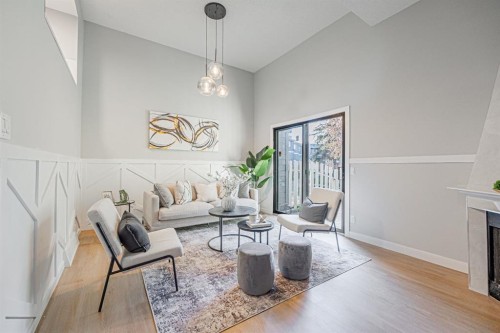 602-919 38 Street Ne, Calgary, AB - Indoor Photo Showing Living Room With Fireplace