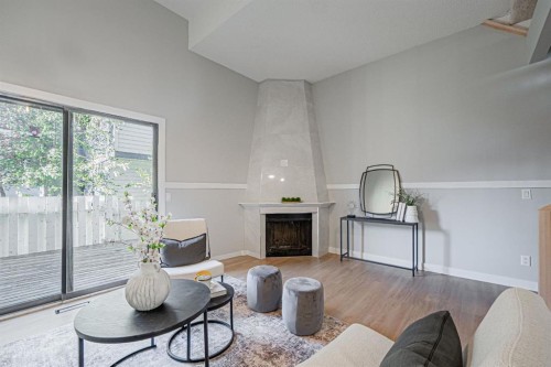 602-919 38 Street Ne, Calgary, AB - Indoor Photo Showing Living Room With Fireplace
