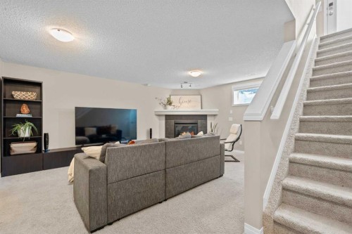 38 Auburn Bay Gardens Se, Calgary, AB - Indoor With Fireplace