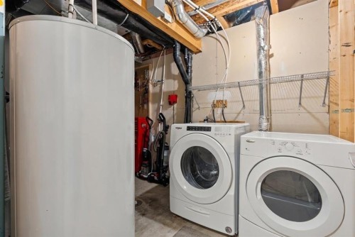 38 Auburn Bay Gardens Se, Calgary, AB - Indoor Photo Showing Laundry Room