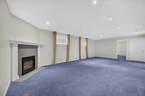 21 Strathearn Gardens Sw, Calgary, AB - Indoor With Fireplace
