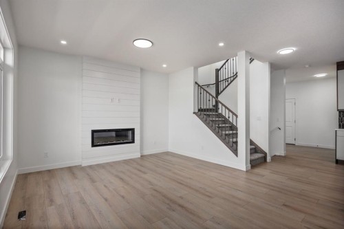 140 Lakewood Crescent, Strathmore, AB - Indoor Photo Showing Other Room With Fireplace