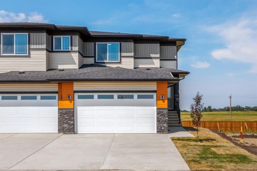 140 Lakewood Crescent, Strathmore, AB - Outdoor With Facade