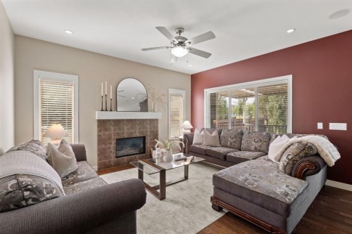 25 Masters Park Se, Calgary, AB - Indoor Photo Showing Living Room With Fireplace