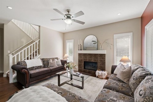 25 Masters Park Se, Calgary, AB - Indoor Photo Showing Living Room With Fireplace