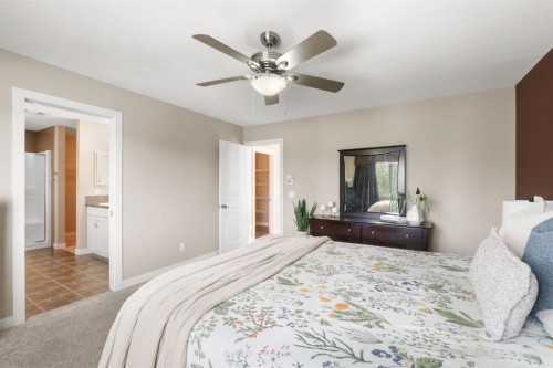 25 Masters Park Se, Calgary, AB - Indoor Photo Showing Bedroom