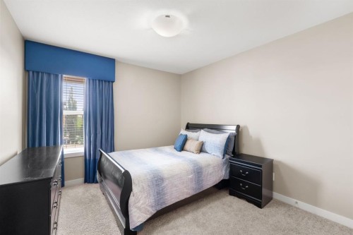 25 Masters Park Se, Calgary, AB - Indoor Photo Showing Bedroom
