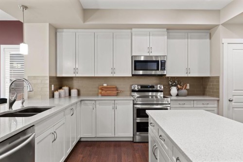 25 Masters Park Se, Calgary, AB - Indoor Photo Showing Kitchen With Stainless Steel Kitchen With Double Sink