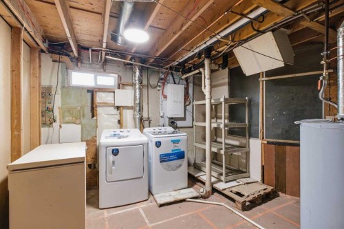 7807 Olympia Bay Se, Calgary, AB - Indoor Photo Showing Laundry Room