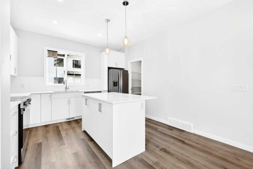 301-40 Creekside Way Sw, Calgary, AB - Indoor Photo Showing Kitchen With Upgraded Kitchen