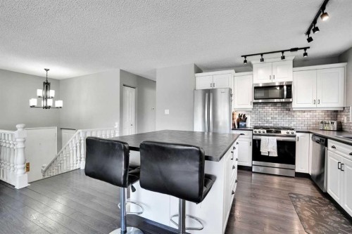 9667 Oakhill Drive Sw, Calgary, AB - Indoor Photo Showing Kitchen With Stainless Steel Kitchen With Upgraded Kitchen