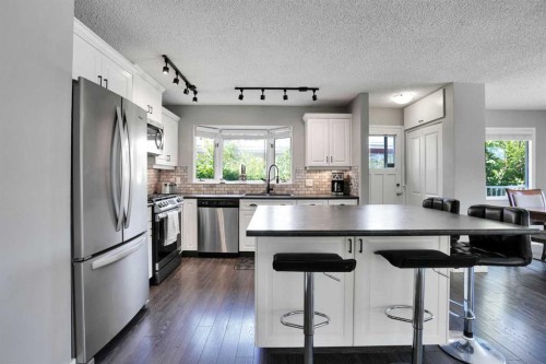 9667 Oakhill Drive Sw, Calgary, AB - Indoor Photo Showing Kitchen With Stainless Steel Kitchen With Upgraded Kitchen