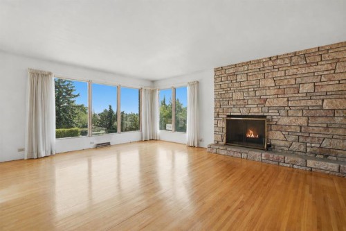 1556 Windsor Street Nw, Calgary, AB - Indoor Photo Showing Living Room With Fireplace