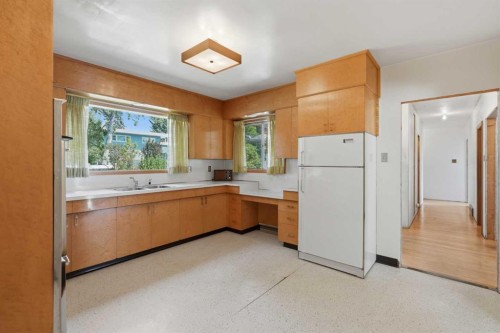 1556 Windsor Street Nw, Calgary, AB - Indoor Photo Showing Kitchen With Double Sink