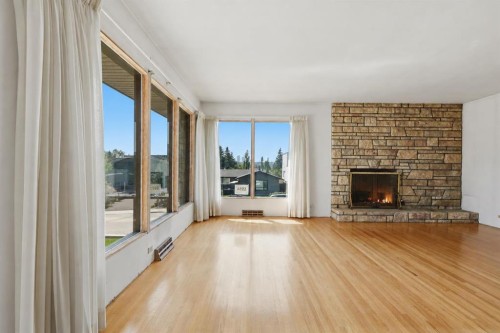 1556 Windsor Street Nw, Calgary, AB - Indoor Photo Showing Living Room With Fireplace
