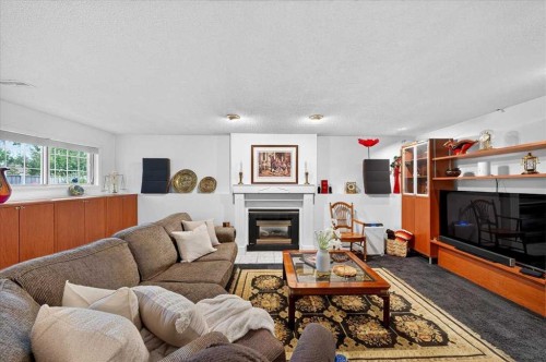 176 Sandpiper Circle Nw, Calgary, AB - Indoor Photo Showing Living Room With Fireplace