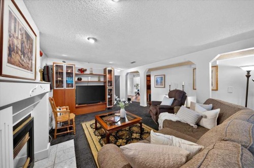 176 Sandpiper Circle Nw, Calgary, AB - Indoor Photo Showing Living Room With Fireplace