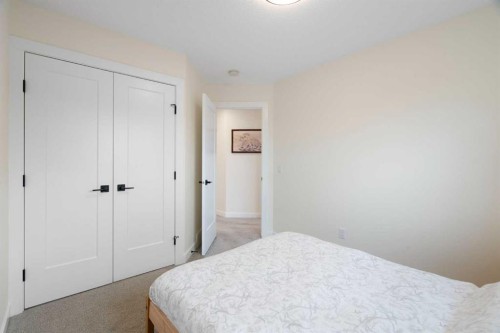 49 River Heights Drive, Cochrane, AB - Indoor Photo Showing Bedroom