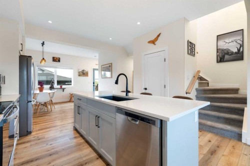 49 River Heights Drive, Cochrane, AB - Indoor Photo Showing Kitchen With Stainless Steel Kitchen With Upgraded Kitchen