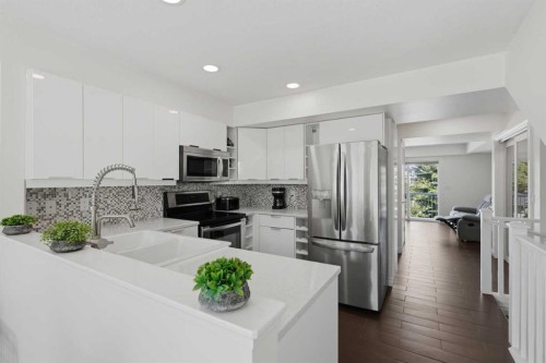 12 Chaparral Ridge Park Se, Calgary, AB - Indoor Photo Showing Kitchen With Double Sink With Upgraded Kitchen