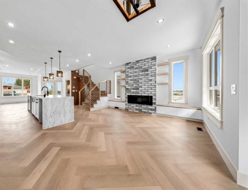 121 42 Avenue Ne, Calgary, AB - Indoor Photo Showing Living Room With Fireplace