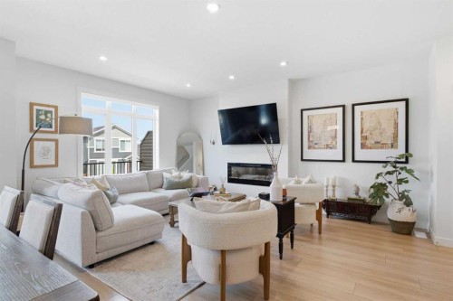 31 Seton Row Se, Calgary, AB - Indoor Photo Showing Living Room With Fireplace
