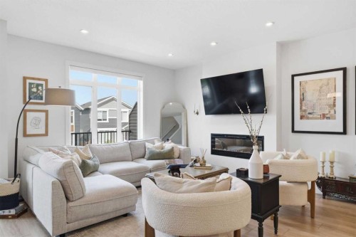 31 Seton Row Se, Calgary, AB - Indoor Photo Showing Living Room With Fireplace