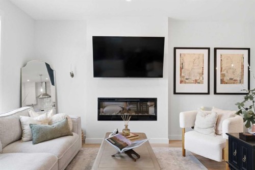 31 Seton Row Se, Calgary, AB - Indoor Photo Showing Living Room With Fireplace