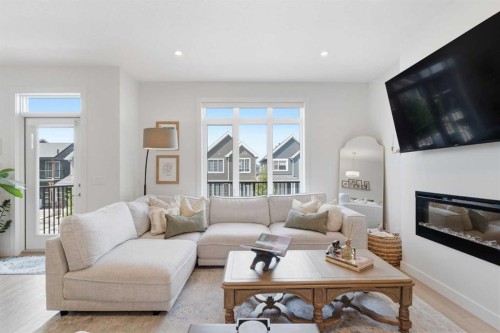 31 Seton Row Se, Calgary, AB - Indoor Photo Showing Living Room With Fireplace