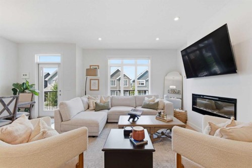 31 Seton Row Se, Calgary, AB - Indoor Photo Showing Living Room With Fireplace