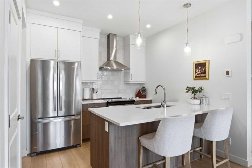 31 Seton Row Se, Calgary, AB - Indoor Photo Showing Kitchen With Stainless Steel Kitchen With Upgraded Kitchen