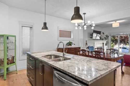1-4711 17 Avenue Nw, Calgary, AB - Indoor Photo Showing Kitchen With Double Sink With Upgraded Kitchen