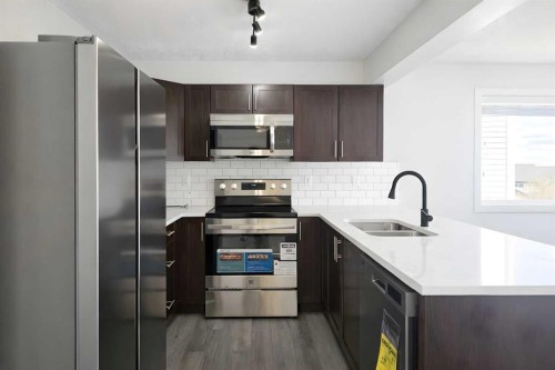 137 Pantego Lane Nw, Calgary, AB - Indoor Photo Showing Kitchen With Stainless Steel Kitchen With Double Sink With Upgraded Kitchen