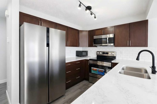 137 Pantego Lane Nw, Calgary, AB - Indoor Photo Showing Kitchen With Stainless Steel Kitchen With Double Sink With Upgraded Kitchen