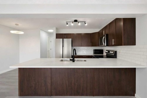 137 Pantego Lane Nw, Calgary, AB - Indoor Photo Showing Kitchen With Double Sink