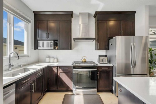 143 Dawson Harbour Hill, Chestermere, AB - Indoor Photo Showing Kitchen With Upgraded Kitchen