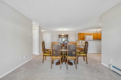 7207-304 Mackenzie Way Sw, Airdrie, AB - Indoor Photo Showing Dining Room